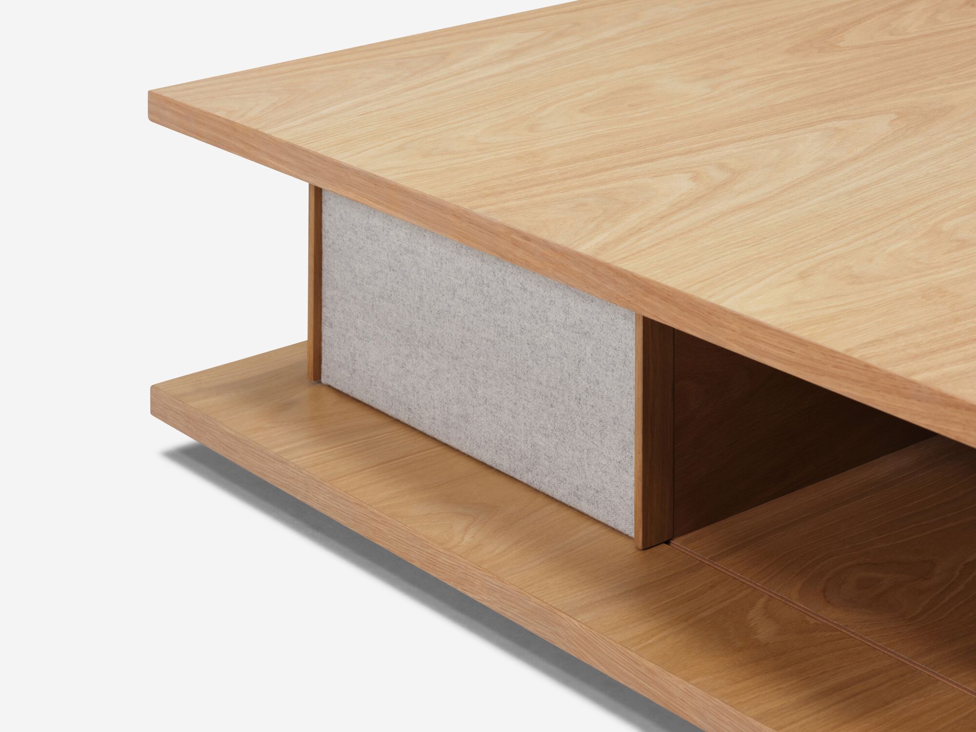 Detail view of the Plank modern square coffee table in oak with fabric panels
