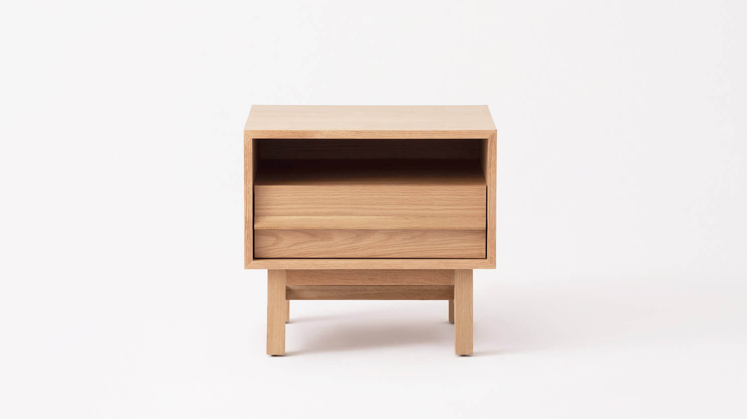Front view of the Marcel open shelf modern nightstand in oak