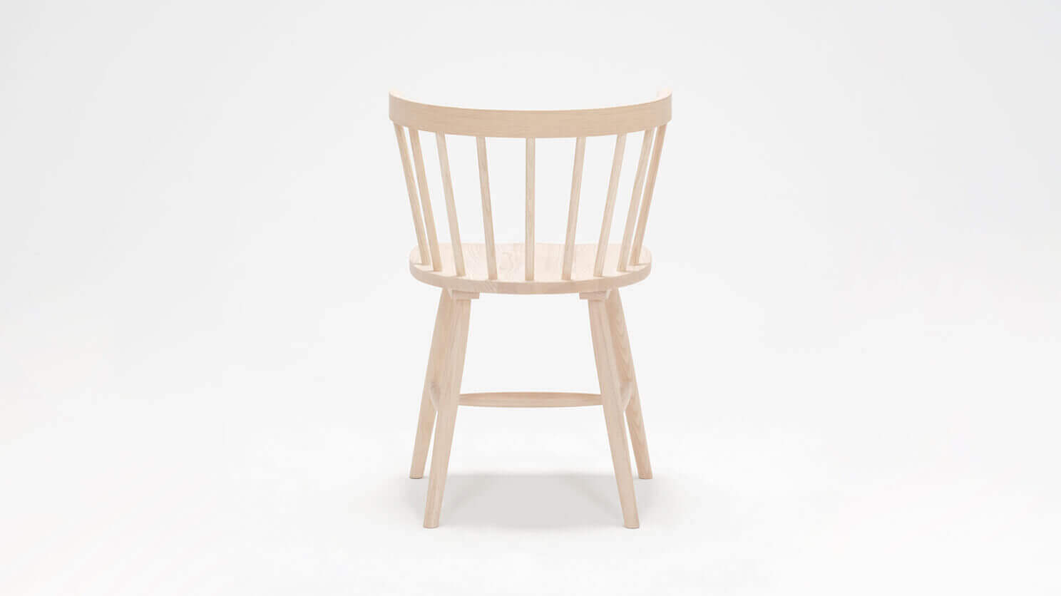 Back view of the Lyla dining room chair in solid ash