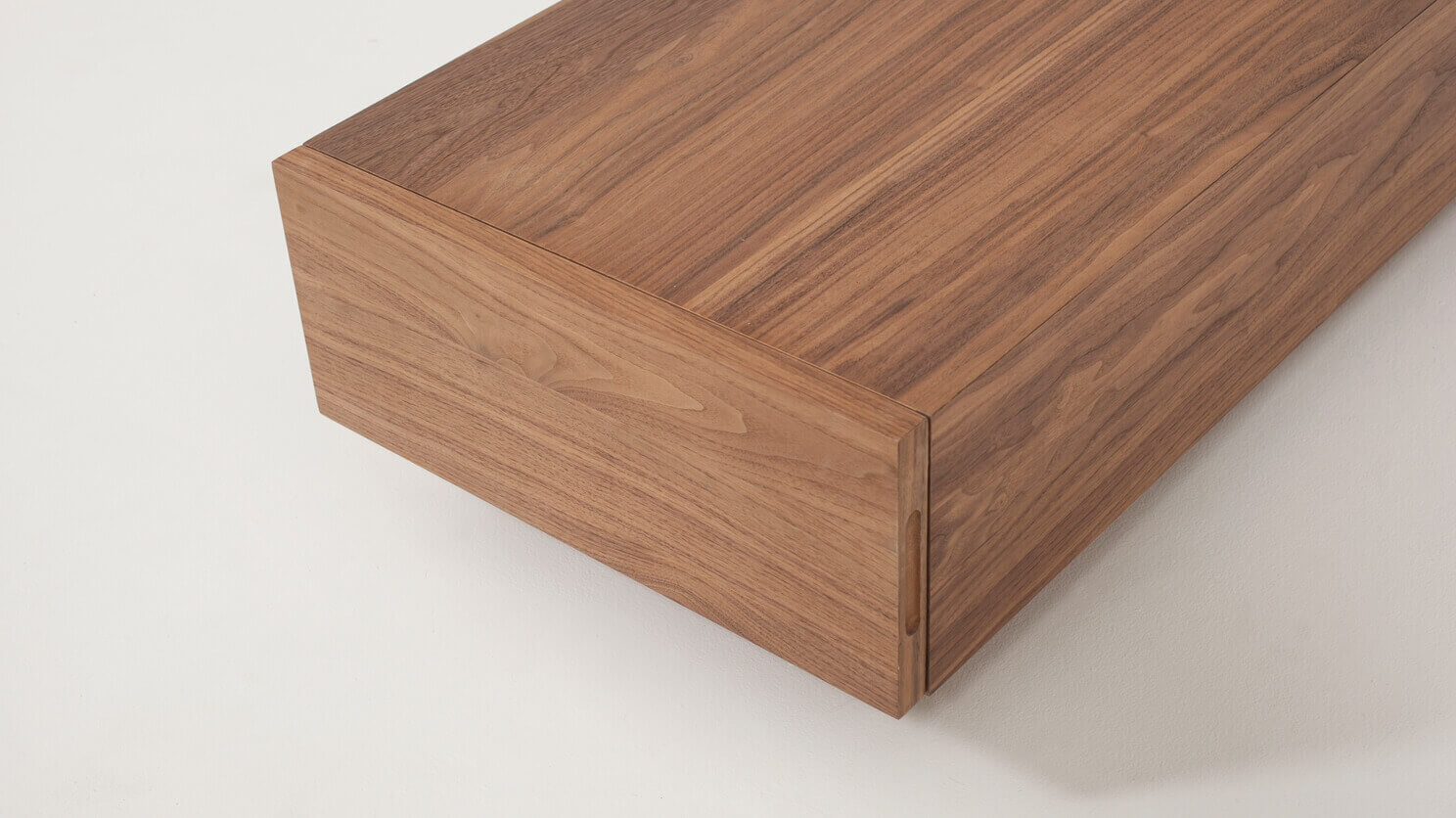 Detail view of the Boom 2-drawer modern coffee table for sectional in walnut