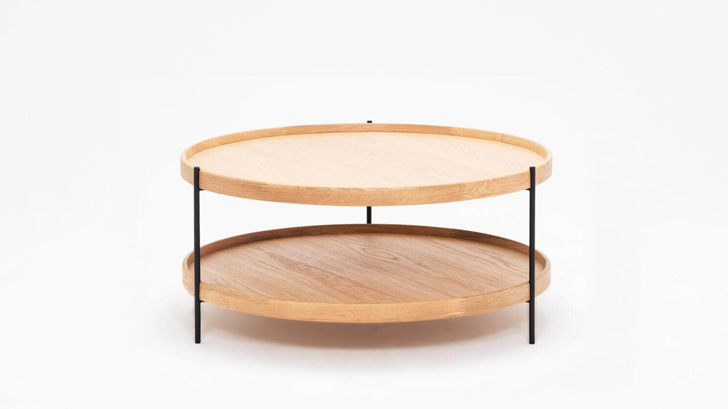 Side view of the small Sage round coffee table in oak